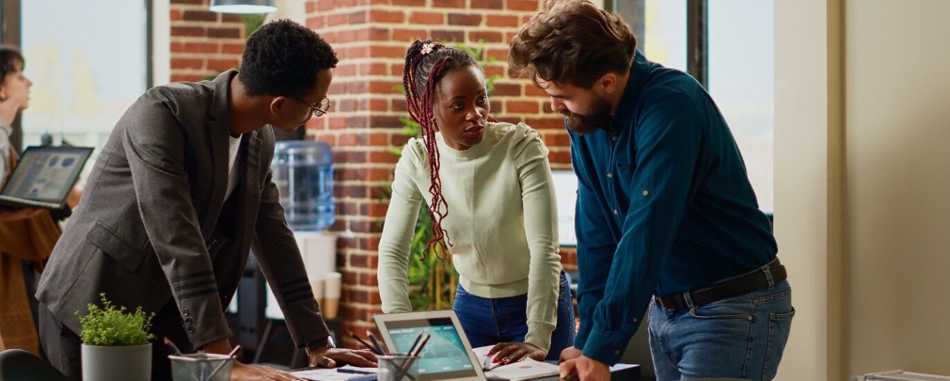Three people in a meeting