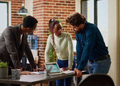 Three people in a meeting
